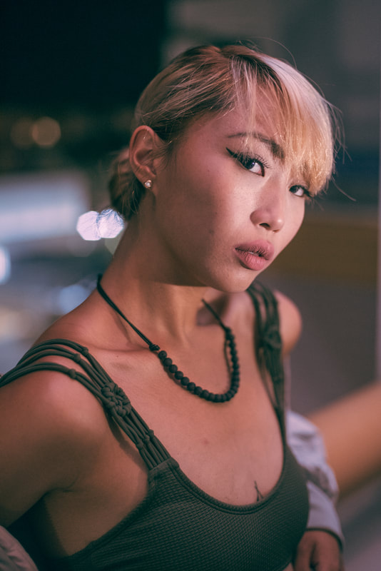 asian girl with necklace at night